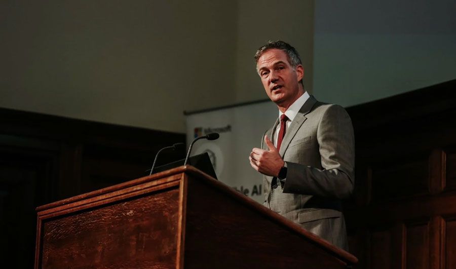 Man talking at plinth