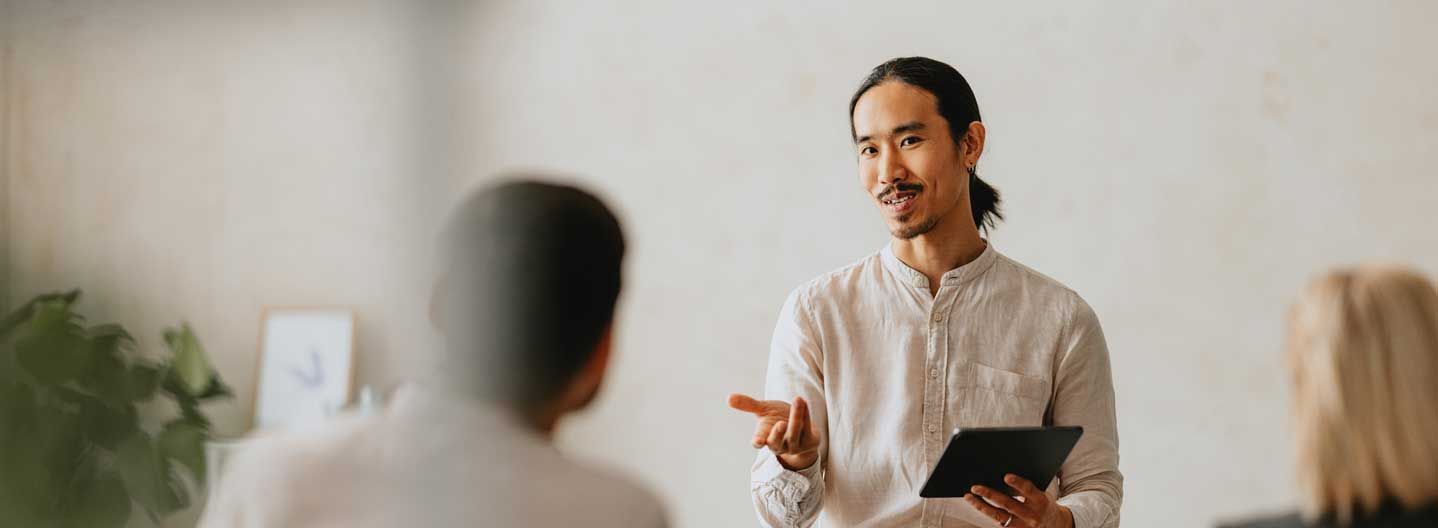 Man talking at front of class