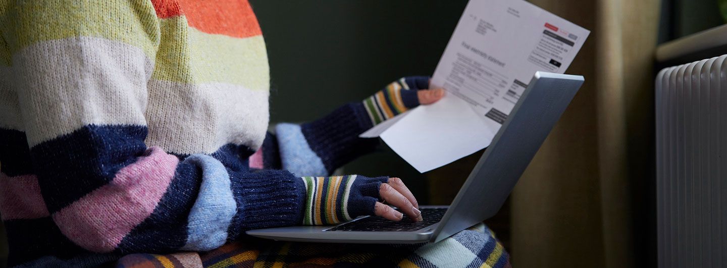 Gloved hands on keyboard