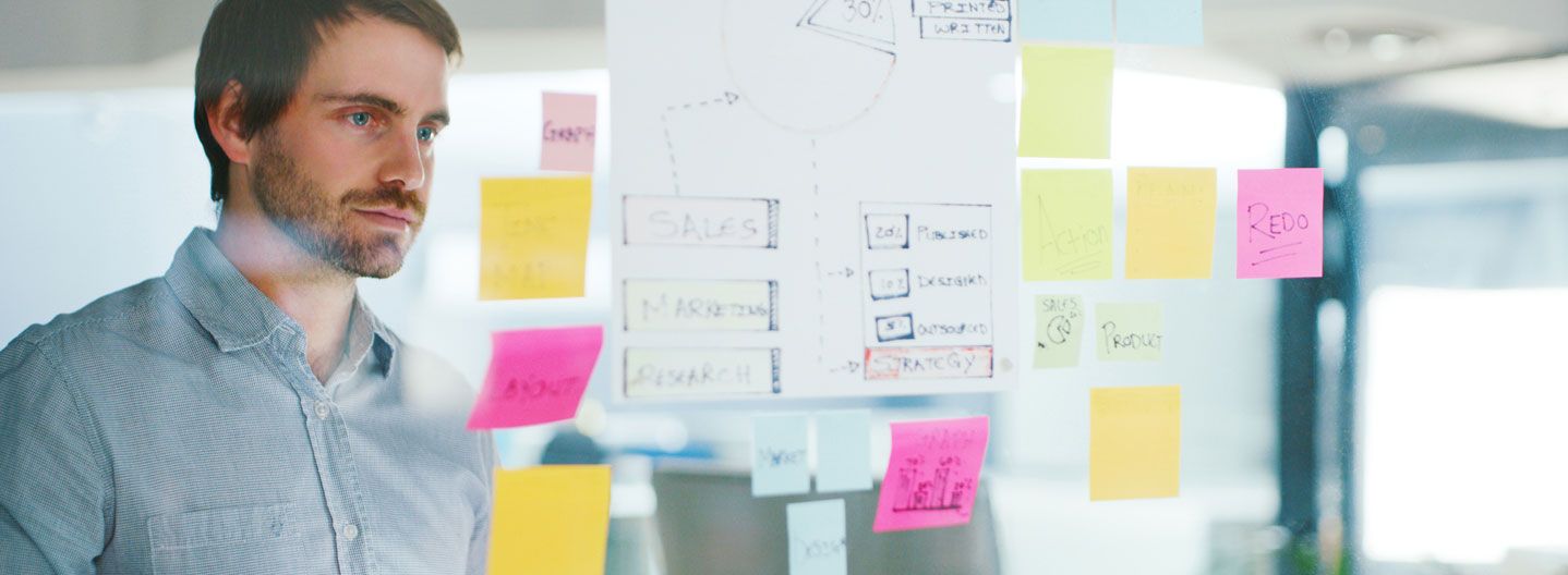 Man looking at schematics