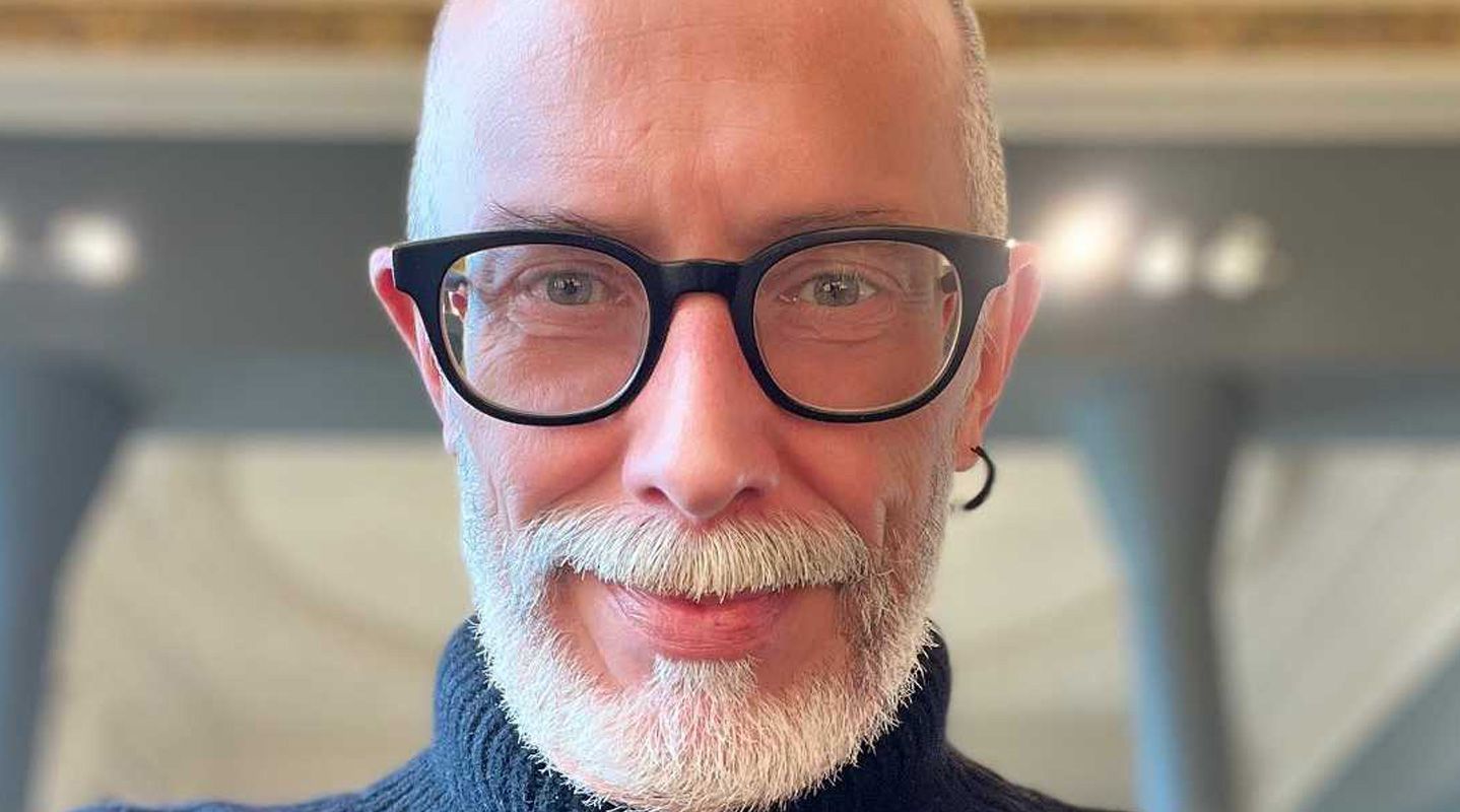 Man in glasses smiling