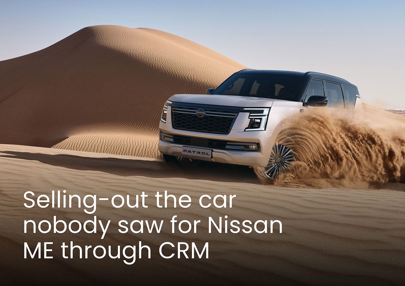 Nissan 4x4 making a turn in sand