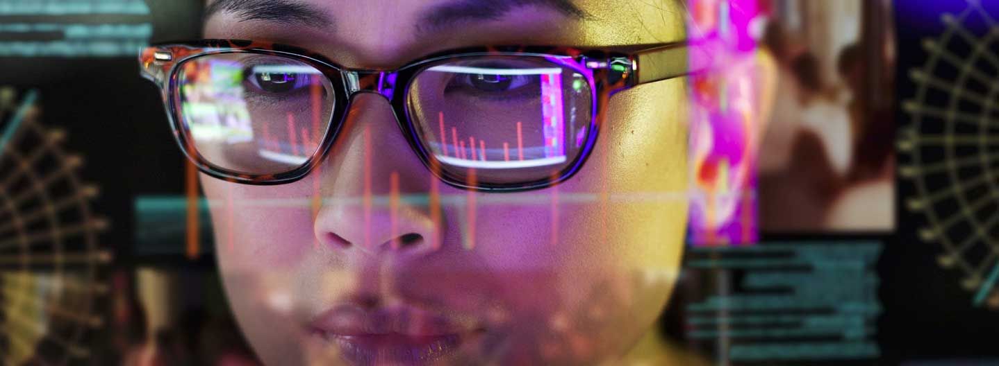 Women looking at data on computer