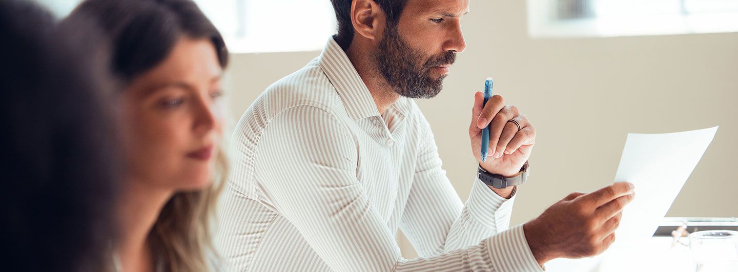 Man looking at a paper